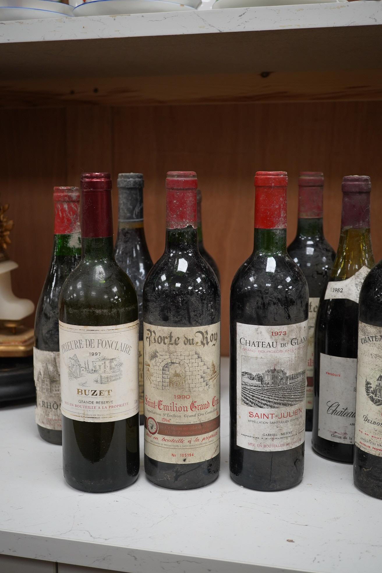 Eleven bottles of red wine to include two bottles of Porte du Roy, St-Emilion Grand Cru, 1990 and a bottle of Chateauneuf du Pape 1981 & 1982. Condition - storage unknown